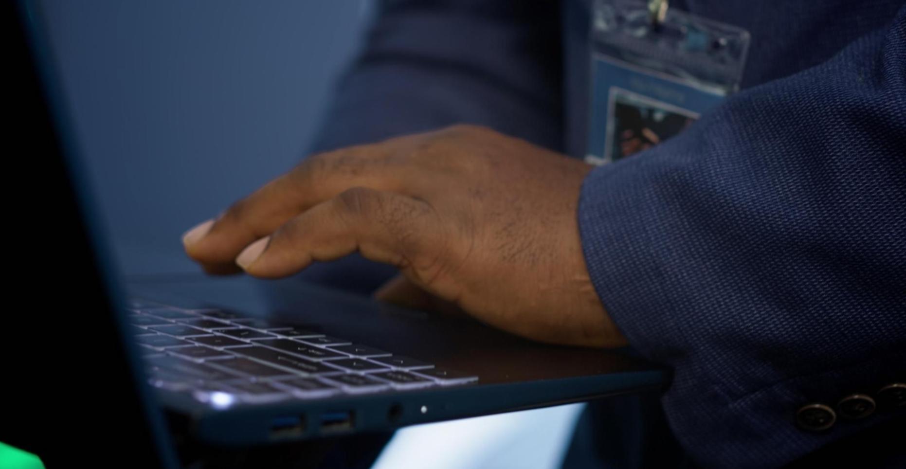 Developer testing RPG game performance on multiple mobile devices simultaneously